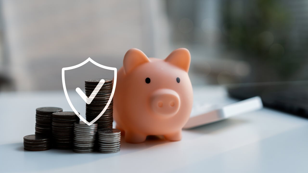 Does your insurance cover need a mid-life review? A piggy bank with coins