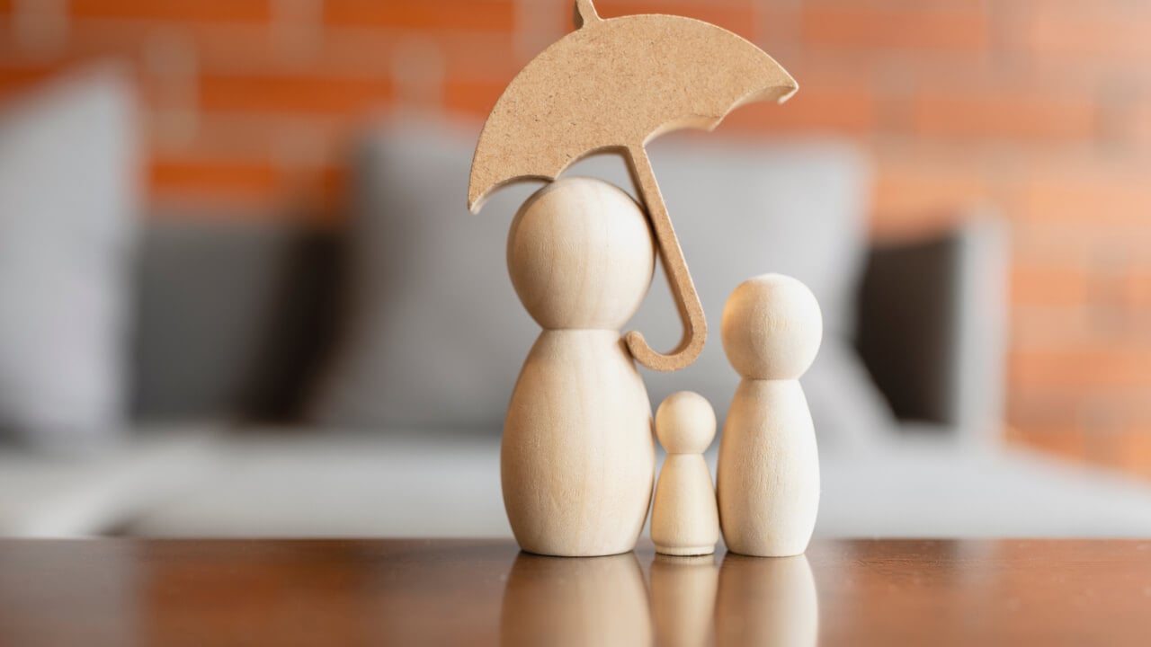 How much insurance cover is enough? Wooden figures on a table