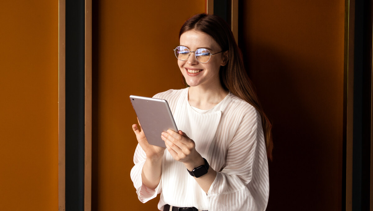 A young professional office worker on her tablet.