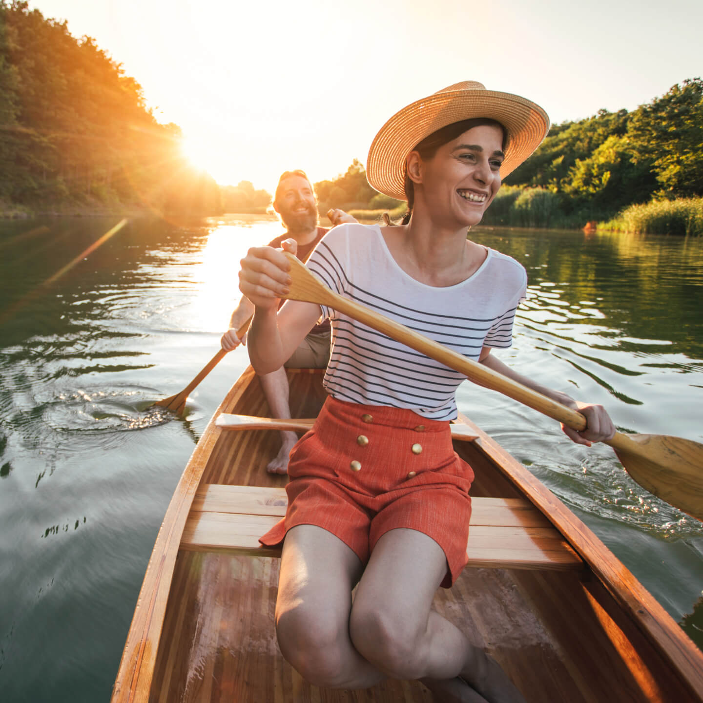 Man and woman kayaking on lake