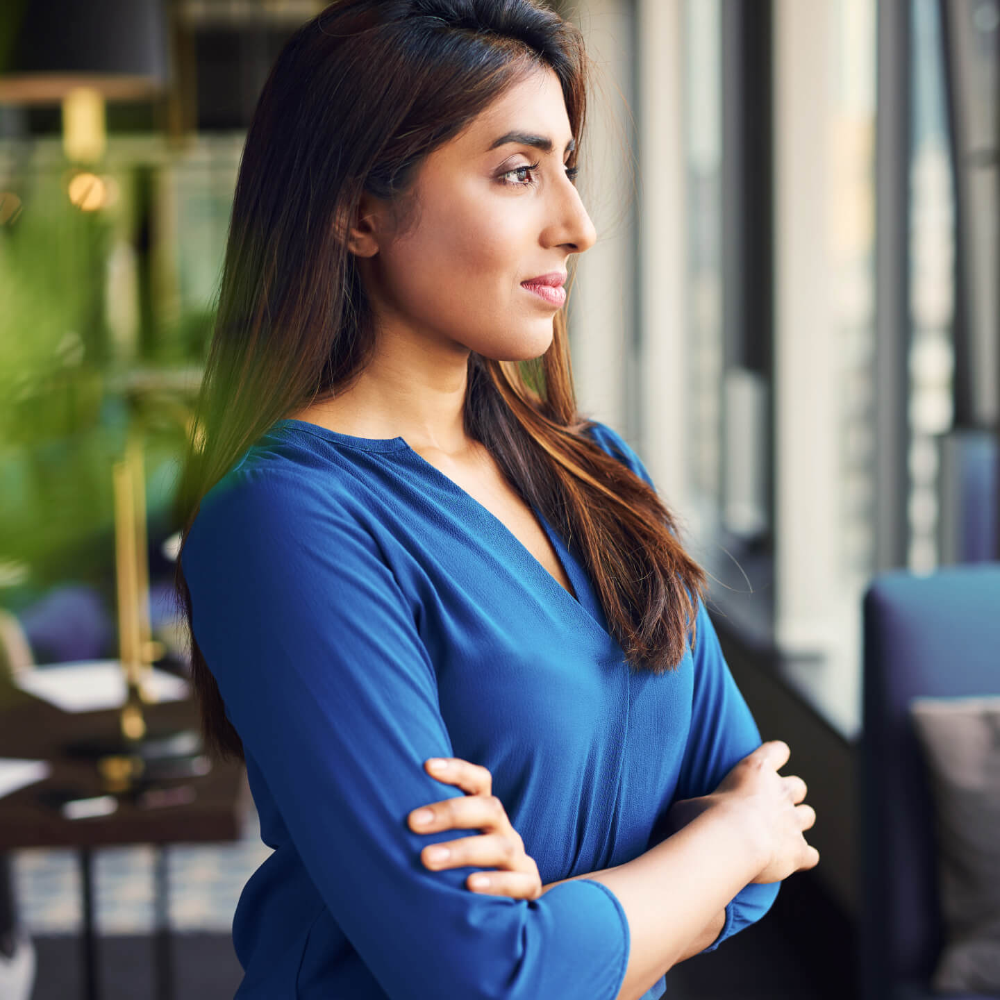Professional businesswoman folding arms