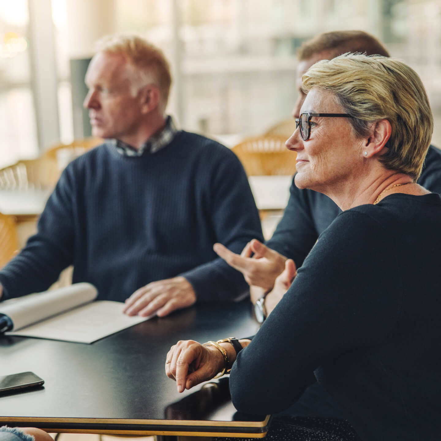 workers-in-office-having-meeting-reversed.jpg